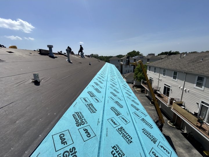 Roof underlayment and ice and water barrier installed along the roof edge